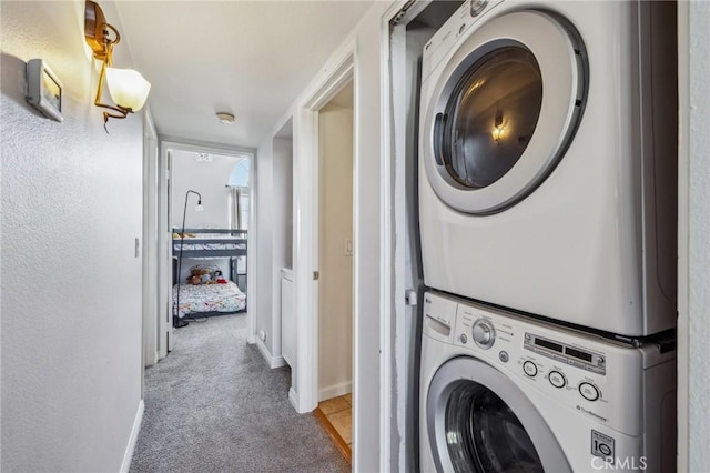 18107 Erik Ct Unit 462, Canyon Country, CA 91387 - washroom with stacked washer / drying machine, light colored carpet, and baseboards