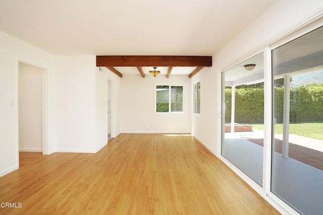 513 E Comstock Ave, Glendora, CA 91741 - empty room with light wood finished floors and beamed ceiling