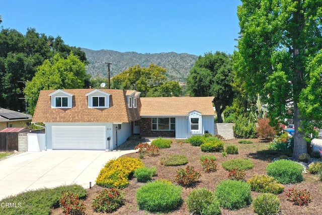 513 E Comstock Ave, Glendora, CA 91741 - view of front facade featuring an attached garage, a mountain view, driveway, and a shingled roof