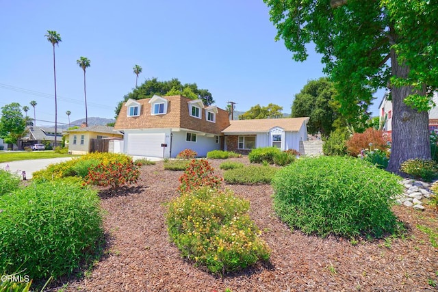 513 E Comstock Ave, Glendora, CA 91741 - view of front of home with a shingled roof, mansard roof, and an attached garage