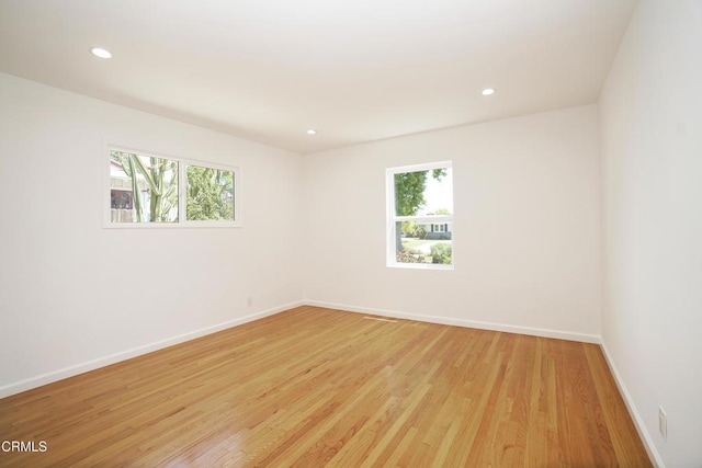 513 E Comstock Ave, Glendora, CA 91741 - empty room featuring plenty of natural light, light wood-style floors, and recessed lighting