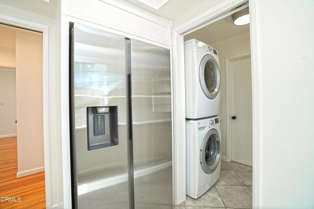 513 E Comstock Ave, Glendora, CA 91741 - laundry area with stacked washer / dryer and light tile patterned floors