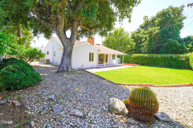 513 E Comstock Ave, Glendora, CA 91741 - back of house with stucco siding, a chimney, a lawn, and a patio area