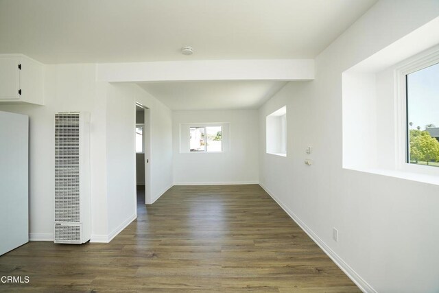513 E Comstock Ave, Glendora, CA 91741 - empty room with a heating unit, a smoke detector, and wood finished floors