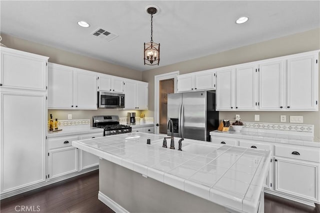 28409 Connick Pl, Saugus, CA 91350 - kitchen with appliances with stainless steel finishes, white cabinetry, and recessed lighting