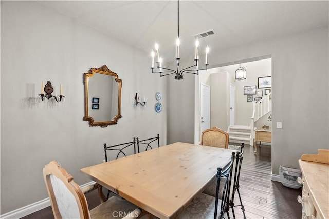 28409 Connick Pl, Saugus, CA 91350 - dining room featuring a chandelier, stairway, dark wood-style floors, and baseboards