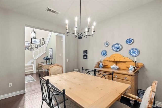 28409 Connick Pl, Saugus, CA 91350 - dining room with baseboards, a chandelier, dark wood finished floors, and stairway