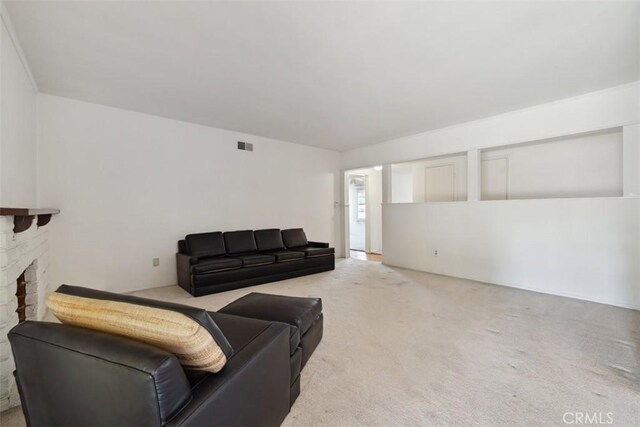 13126 Roscoe Blvd, Sun Valley, CA 91352 - living room featuring light colored carpet and a fireplace