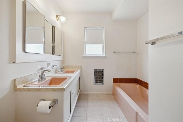 13126 Roscoe Blvd, Sun Valley, CA 91352 - bathroom featuring a bath, double vanity, and tile patterned floors