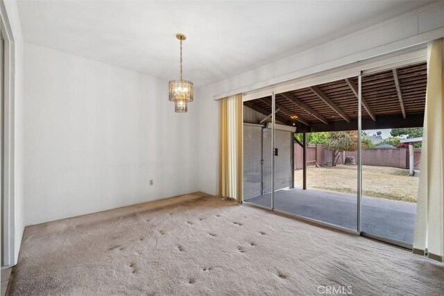 13126 Roscoe Blvd, Sun Valley, CA 91352 - unfurnished room featuring a chandelier and carpet flooring