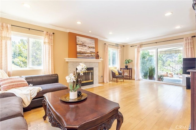 11811 Louise Ave, Granada Hills, CA 91344 - living area featuring a tiled fireplace, ornamental molding, recessed lighting, and light wood finished floors