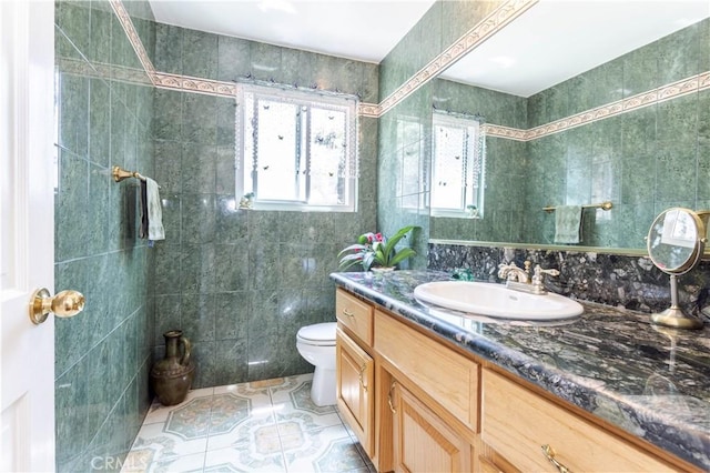 11811 Louise Ave, Granada Hills, CA 91344 - bathroom featuring tile walls, vanity, tile patterned floors, and toilet