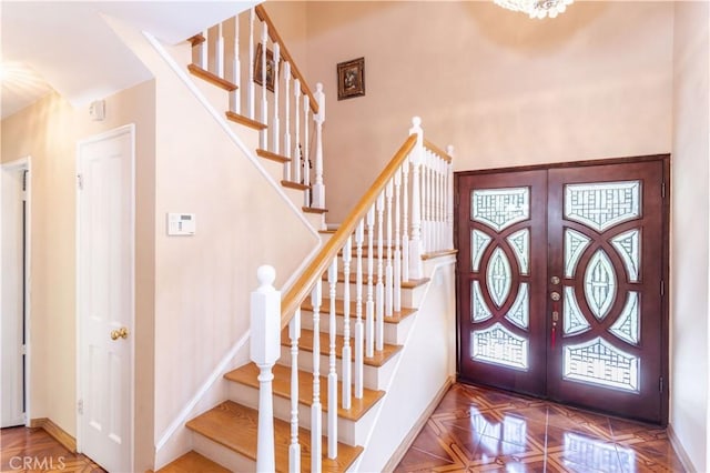11811 Louise Ave, Granada Hills, CA 91344 - entryway featuring french doors, stairs, and baseboards