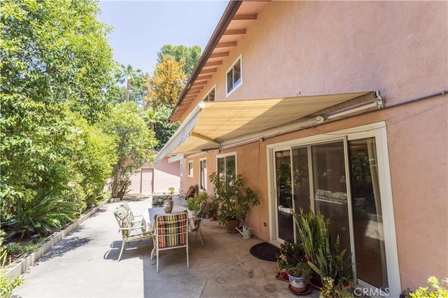 11811 Louise Ave, Granada Hills, CA 91344 - view of patio / terrace featuring outdoor dining space and an outbuilding
