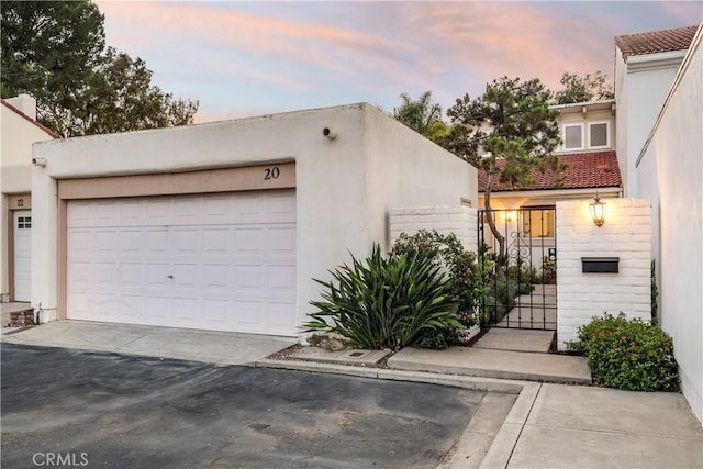 20 Mandrake Way, Irvine, CA 92612 - view of front of house with a garage and stucco siding