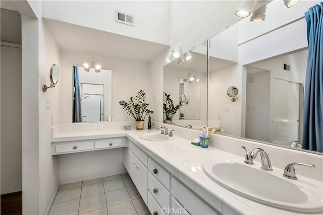 20 Mandrake Way, Irvine, CA 92612 - bathroom featuring tile patterned floors, double vanity, and baseboards
