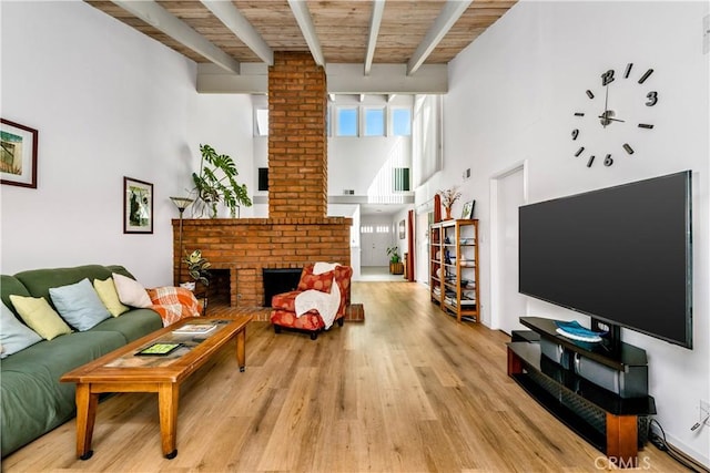 20 Mandrake Way, Irvine, CA 92612 - living room featuring light wood-type flooring, a brick fireplace, a high ceiling, and wood ceiling with exposed beams