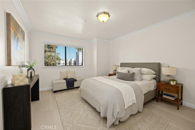 70 N Catalina Ave Unit 306, Pasadena, CA 91106 - bedroom featuring ornamental molding, baseboards, and light wood-style floors