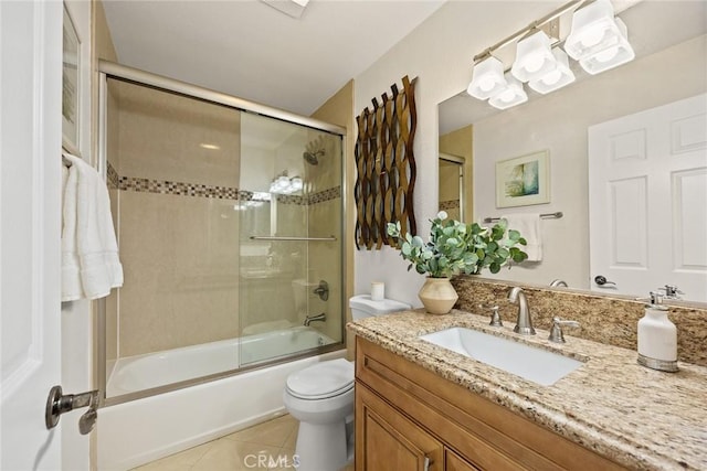 70 N Catalina Ave Unit 306, Pasadena, CA 91106 - bathroom with vanity, tile patterned flooring, bath / shower combo with glass door, and toilet