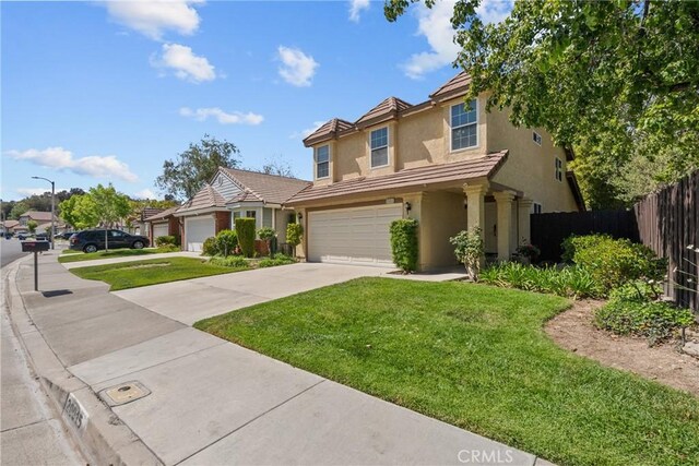 20015 Gilbert Dr, Canyon Country, CA 91351 - traditional-style house featuring stucco siding, driveway, and an attached garage