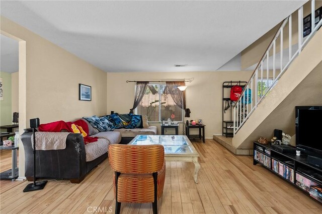20015 Gilbert Dr, Canyon Country, CA 91351 - living room featuring hardwood / wood-style floors and stairway