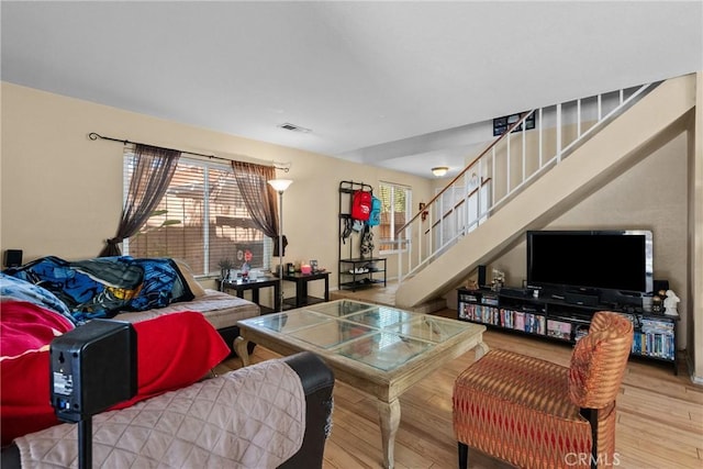 20015 Gilbert Dr, Canyon Country, CA 91351 - living room with plenty of natural light, stairs, and wood finished floors