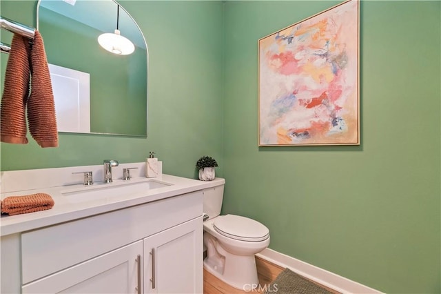 1890 Pele Way, Corona, CA 92882 - bathroom with vanity, toilet, wood finished floors, and baseboards