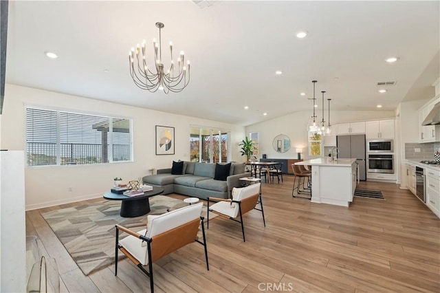 1890 Pele Way, Corona, CA 92882 - living room with vaulted ceiling, light wood-type flooring, recessed lighting, and a chandelier