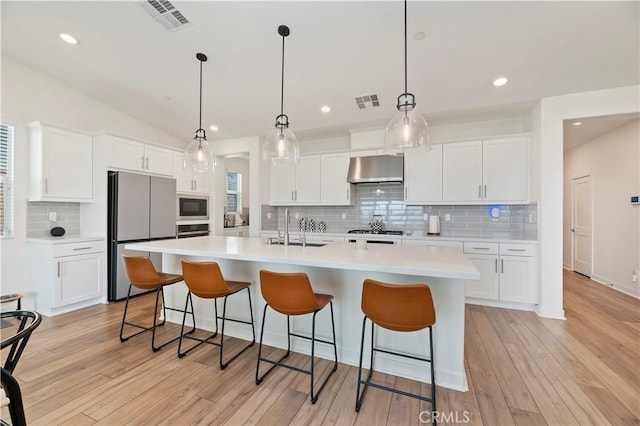 1890 Pele Way, Corona, CA 92882 - kitchen with appliances with stainless steel finishes, a sink, ventilation hood, tasteful backsplash, and light countertops
