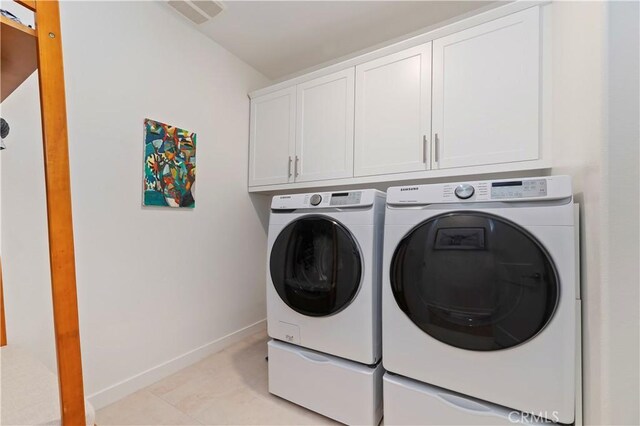 1890 Pele Way, Corona, CA 92882 - washroom with washer and clothes dryer and cabinet space
