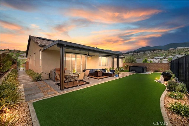 1890 Pele Way, Corona, CA 92882 - rear view of house featuring a hot tub, an outdoor living space, a patio area, ceiling fan, and stucco siding