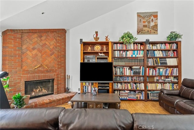 52 Hidden Valley Rd, Monrovia, CA 91016 - living room with lofted ceiling, wood finished floors, and a fireplace