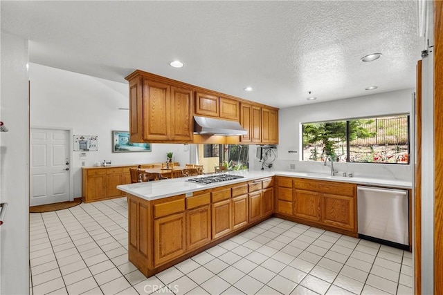 52 Hidden Valley Rd, Monrovia, CA 91016 - kitchen featuring stainless steel appliances, under cabinet range hood, light countertops, a sink, and recessed lighting