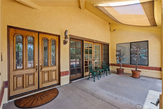 52 Hidden Valley Rd, Monrovia, CA 91016 - property entrance with french doors, stucco siding, and a porch