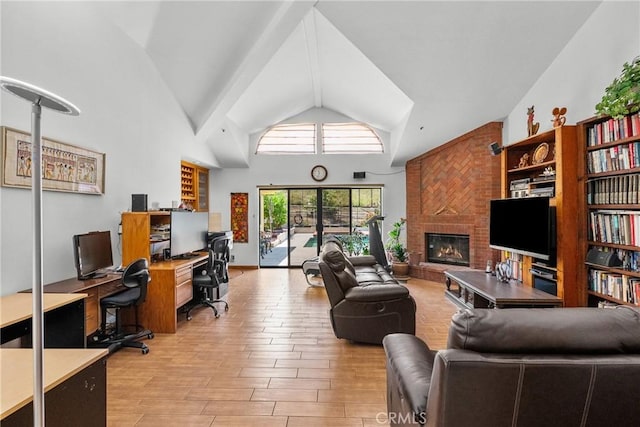 52 Hidden Valley Rd, Monrovia, CA 91016 - living area with a desk, a fireplace, light wood-style floors, and high vaulted ceiling