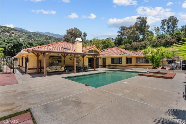 52 Hidden Valley Rd, Monrovia, CA 91016 - view of pool with a patio area, a mountain view, an in-ground hot tub, and a gate