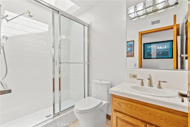 52 Hidden Valley Rd, Monrovia, CA 91016 - bathroom with toilet, vanity, a shower stall, and decorative backsplash