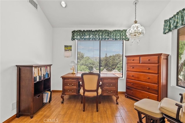 52 Hidden Valley Rd, Monrovia, CA 91016 - home office with lofted ceiling, a chandelier, light wood-type flooring, and baseboards