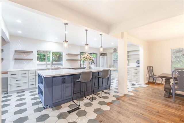 803 Crescent Dr, Monrovia, CA 91016 - kitchen featuring open shelves, light countertops, recessed lighting, and a large island