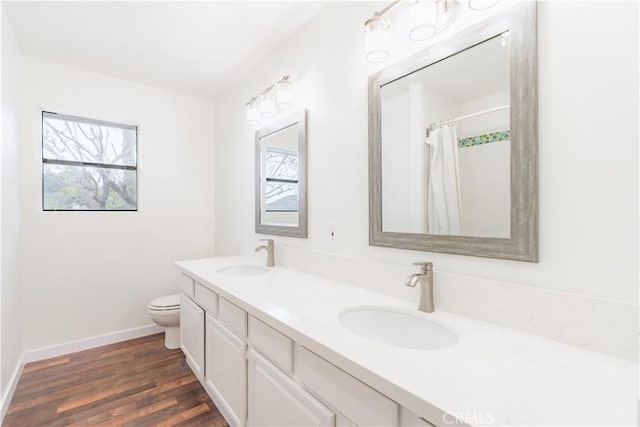 803 Crescent Dr, Monrovia, CA 91016 - bathroom featuring double vanity, wood finished floors, and curtained shower