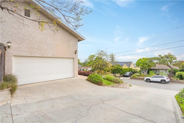803 Crescent Dr, Monrovia, CA 91016 - view of home's exterior featuring driveway and stucco siding