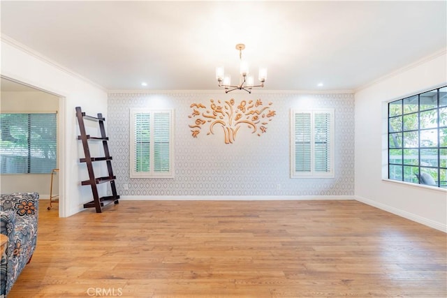 803 Crescent Dr, Monrovia, CA 91016 - unfurnished room with a chandelier, ornamental molding, light wood-style flooring, and wallpapered walls