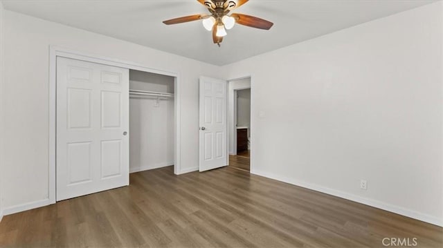 3637 Stauss Ave, Oroville, CA 95966 - unfurnished bedroom with baseboards, wood finished floors, a closet, and a ceiling fan