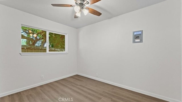 3637 Stauss Ave, Oroville, CA 95966 - unfurnished room featuring wood finished floors, a ceiling fan, and baseboards