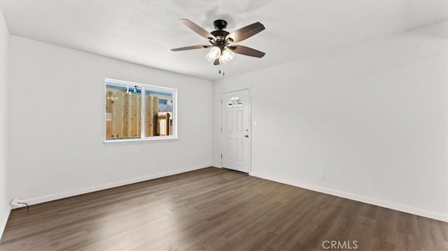 3637 Stauss Ave, Oroville, CA 95966 - spare room featuring dark wood-style floors, ceiling fan, and baseboards
