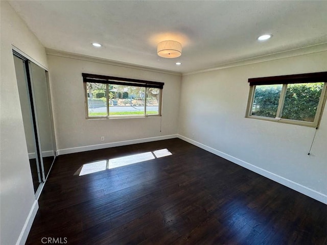 1415 Via Vallarta, Riverside, CA 92506 - unfurnished bedroom with multiple windows, wood finished floors, ornamental molding, a closet, and recessed lighting