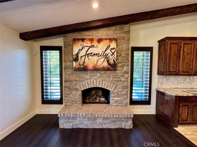 1415 Via Vallarta, Riverside, CA 92506 - living area with dark wood-style floors, plenty of natural light, beam ceiling, a fireplace, and recessed lighting