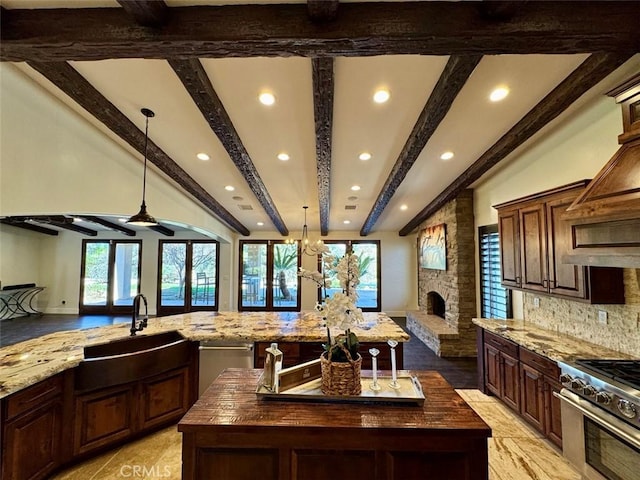 1415 Via Vallarta, Riverside, CA 92506 - kitchen with a center island, recessed lighting, butcher block counters, stainless steel range, and plenty of natural light