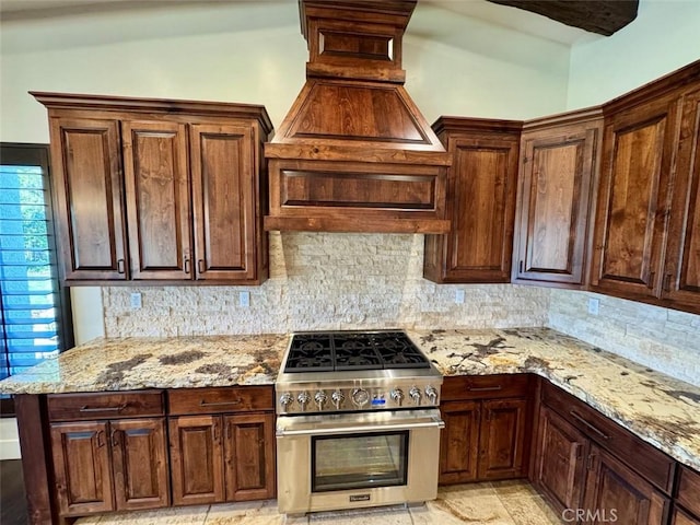 1415 Via Vallarta, Riverside, CA 92506 - kitchen featuring high end stove, backsplash, and light stone counters