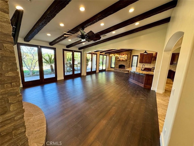 1415 Via Vallarta, Riverside, CA 92506 - unfurnished living room featuring french doors, a stone fireplace, a ceiling fan, dark wood-style floors, and recessed lighting